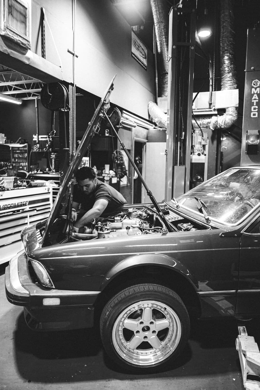 A mechanic working on a customer’s car